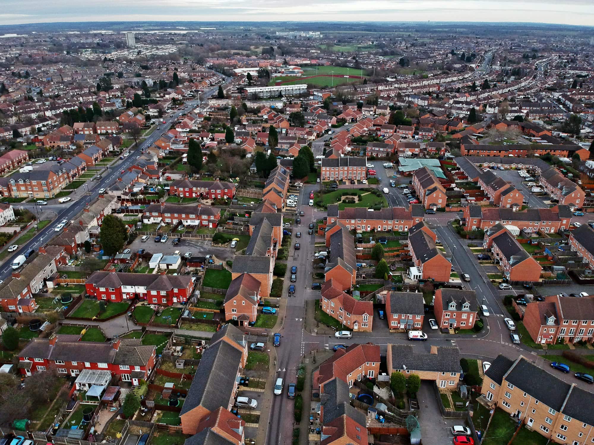 An aerial view across a residential neighbourhood of streets and rooftops.