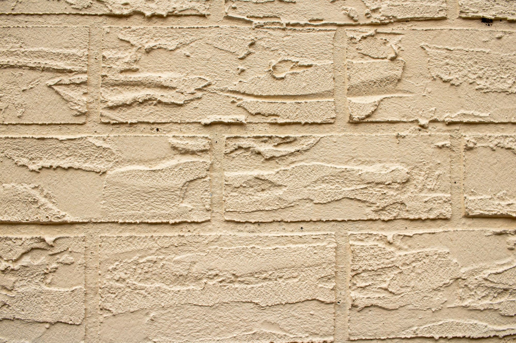 Close detail of buff brickwork showing the masonry bond and crisp mortar joints.